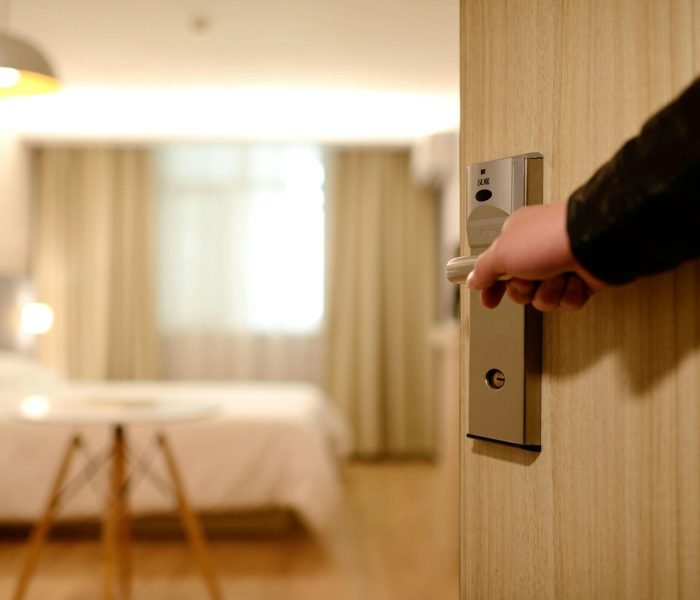 pexels-photo-271639-271639 A soft-lit hotel room entrance, welcoming guests with luxury appeal and comfort.